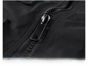 Detail of durable matte black resin zipper and textured fabric on pilot jacket