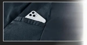 Detail view of the inner secure pocket in a men's jacket holding a smartphone