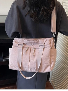Pink nylon crossbody tote bag for women with wide straps and multiple zipper pockets