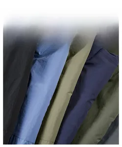 Detail shot of multi-color windbreaker fabric showing durable texture and material quality