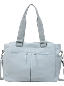 Light blue nylon tote bag with multiple pockets and adjustable shoulder strap
