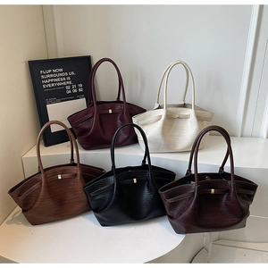 Detailed close-up of high-quality faux woven leather tote bags in five versatile colors
