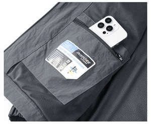 Detail of jacket inner mesh lining and secure zipper pocket with technical specs label