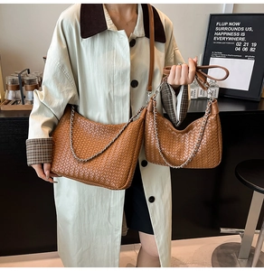 Close-up of woven caramel leather hobo bags with silver chain detail in two sizes