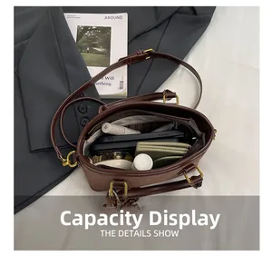 Interior capacity display of brown textured leather bucket bag with daily essentials