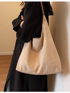 Minimalist beige suede hobo tote bag with brown leather shoulder straps for women