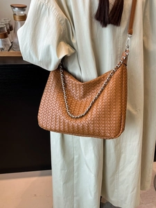 Caramel woven crossbody bag with metal chain strap and long leather shoulder strap