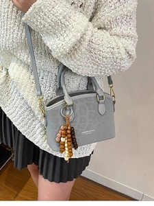 Grey leopard print handbag for women with beaded charm and adjustable shoulder strap