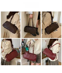 Detail view of premium matte leather tote bags in dark brown and wine red tones