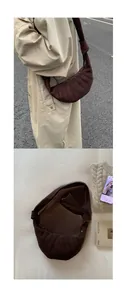 Gros plan sur un sac croissant en daim marron avec texture matelassée et bandoulière