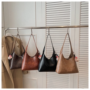 Minimalist faux leather bucket bags in four colors with cute plush bear charms