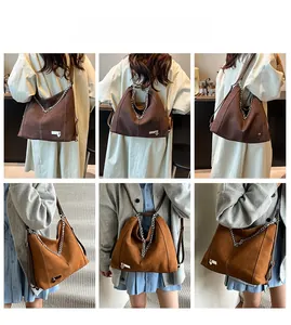 Detail view of large faux suede hobo bags in dark brown and khaki with silver chain