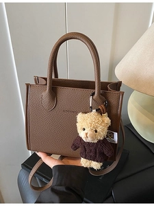 Retro dark brown litchi pattern leather bucket bag with cute teddy bear charm