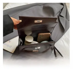 Detail view of large capacity dark brown leather handbag showing interior storage space