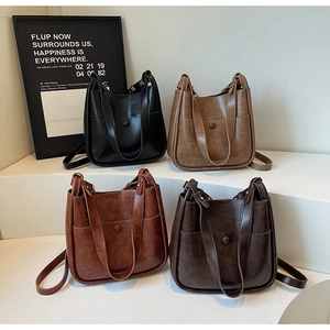 Collection of vintage bucket bags in black, coffee, burgundy, and tan leather
