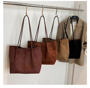 Detailed display of suede tote bags in dark coffee, caramel, camel, and black colors