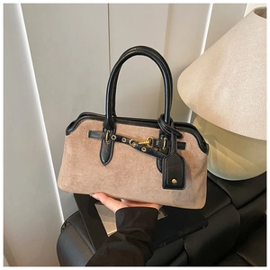 Detail of vintage Boston bag showing khaki frosted texture with black leather handle trim