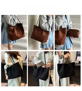 Detail of large suede tote bag set with matching inner pouch and slim shoulder straps