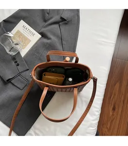 Top view of brown woven bucket bag interior showing spacious storage for daily essentials
