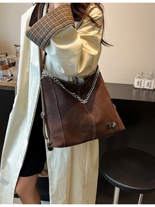 Brown frosted leather Hobo bag with silver heart logo chain detail and adjustable strap