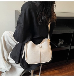 Top view of cream hobo shoulder bag with textured finish and Fashion Trend detail