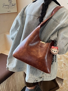 Vintage brown PU leather hobo shoulder bag with a plush puppy charm and embossed text