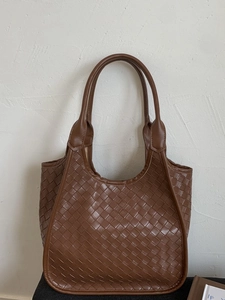 Large dark brown woven leather tote bag with sturdy handles for casual daily use