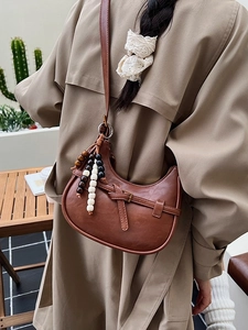 Minimalist vintage dark brown crescent crossbody bag with decorative beaded charm detail