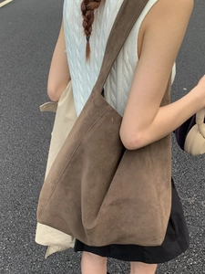 Brown leopard print suede tote bag for women showing large capacity on the shoulder
