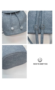 Detail view of denim texture drawstring backpack with metal buckles and clear beads