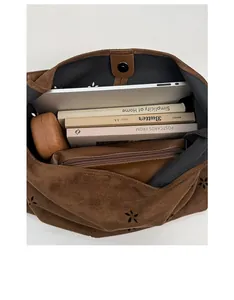 Interior view of brown suede tote bag showing large capacity for laptop and books