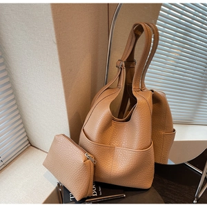 Caramel pebble leather tote bag set with matching small zipper pouch and side pocket