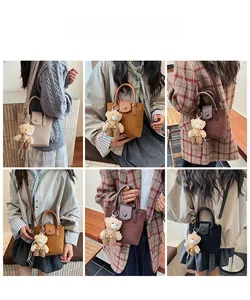 Mini matte shoulder bags in four colors with bear charms shown on a female model