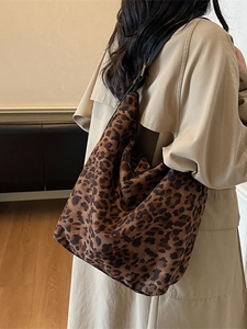 Fashionable leopard print bucket hobo bag with wide black shoulder strap for women