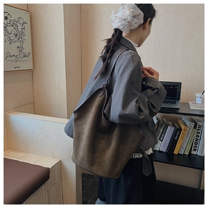 Brown frosted large capacity tote bag shown on model for casual commuting style