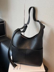 Large capacity black pebble leather tote bag with adjustable strap and front pocket