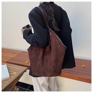 Deep brown frosted suede tote bag showing its large capacity and minimalist design