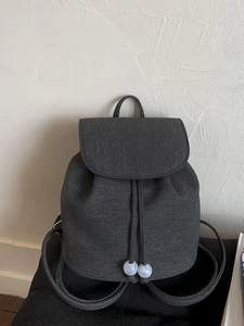 Minimalist dark gray canvas drawstring backpack for women with marble bead details