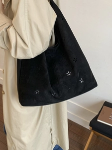 Black suede tote bag with laser-cut floral patterns and large capacity for women