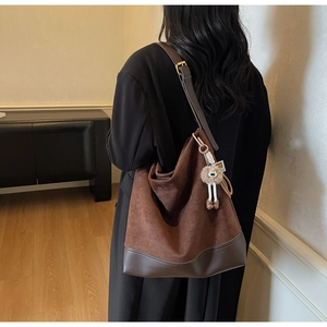 Brown vintage suede tote bag with large capacity and plush charm for daily commute
