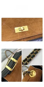 Detailed macro view of brown suede quilted texture and golden metal twist lock closure