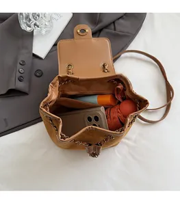 Macro shot of the open mini backpack interior showing large capacity for essentials