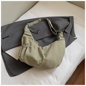 Detailed close-up of green and white gingham hobo bag showing fabric texture and pleats