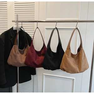 Selection of suede hobo tote bags in brown, burgundy, black and camel colors