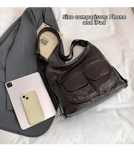 Detailed size comparison of coffee pebbled leather hobo bag with iPad and smartphone