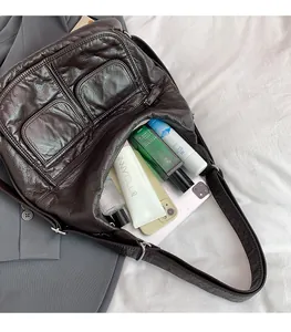 Detail of vintage coffee tote bag showing spacious interior with tablet and cosmetics