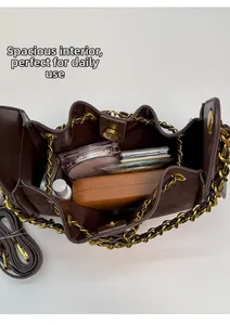 Detailed interior of dark brown bucket bag showing large capacity for daily essentials