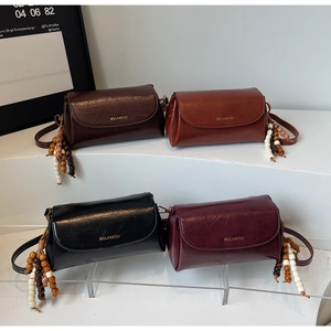 Collection of vintage pillow bags in coffee, red-brown, black and burgundy colors