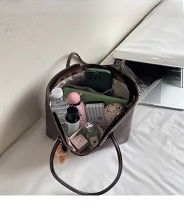 Interior view of brown leather tote bag with ample space for tablet and essentials