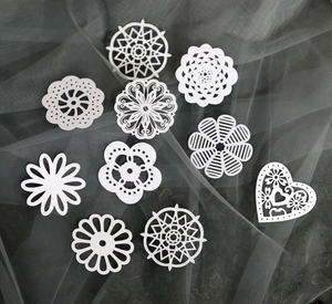 Set of 10 white laser-cut floral lace paper cards with hollow heart and bow patterns